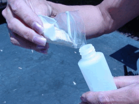 Pouring the beads into the Unique Applicator bottle